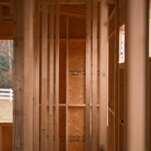 a room that is under construction with wooden framing